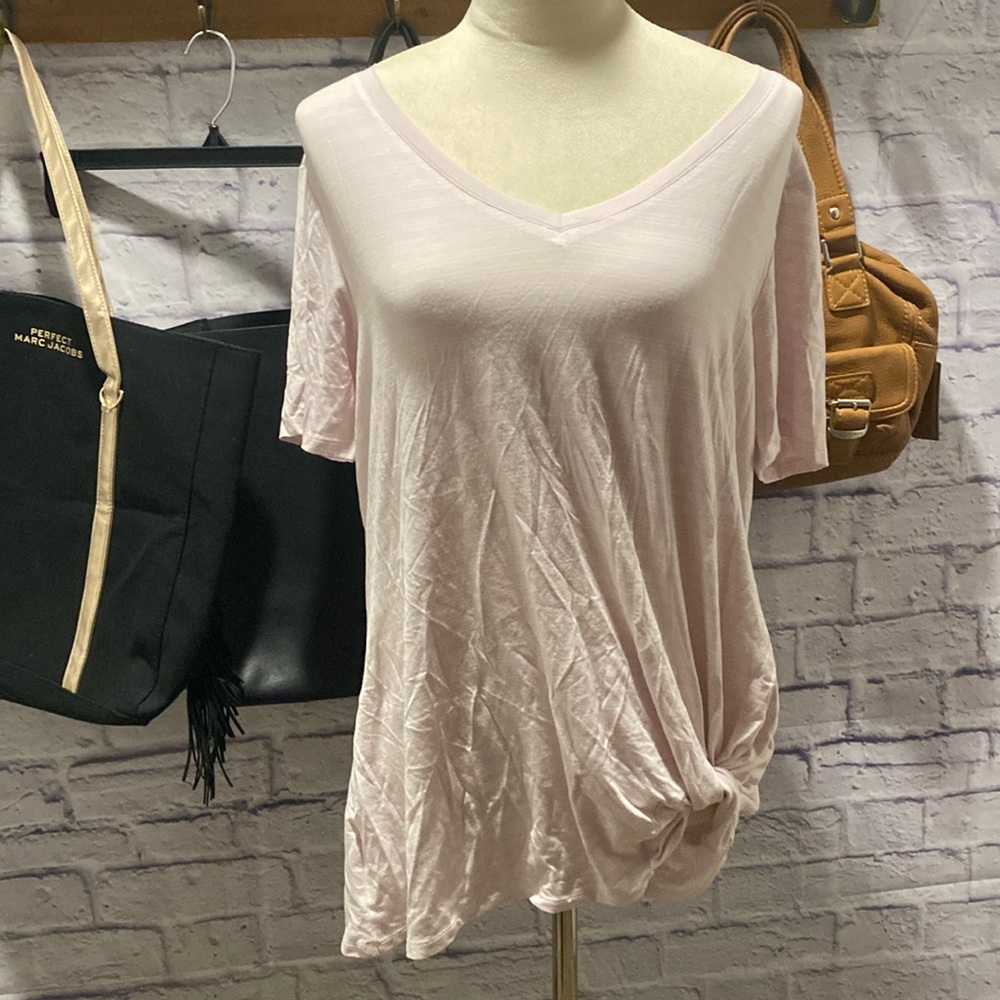 Women’s lightweight shirt. Twist on the side and V-neck